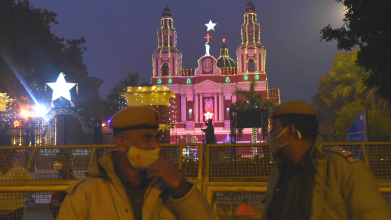 Delhi police standing outside the barricade of the Sacred Heart Cathedral