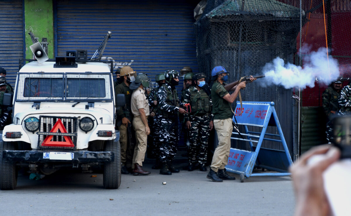 Police personnel in action during clashes with protesters who were protesting against the verdict of JKLF chief Yasin Malik at Maisuma in Srinagar on Wednesday. 